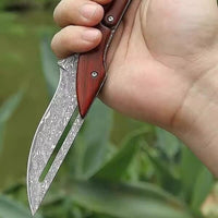 Taschenmesser aus Damast mit Palisanderholzgriff